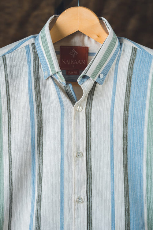 Striped shirt on a hanger with 'Najraan' label visible